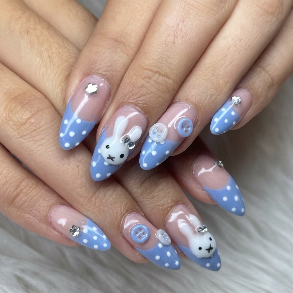 Blue dotted nails with bunny charms and buttons