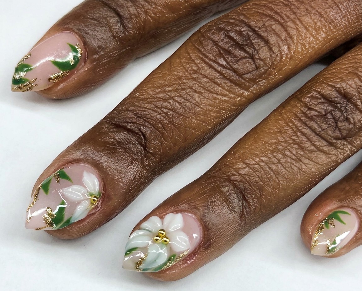 White sculpted flowers with green leaves and gold details