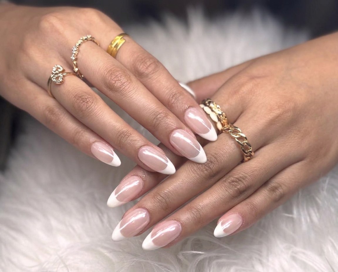 Glossy almond manicure with classic white French tips