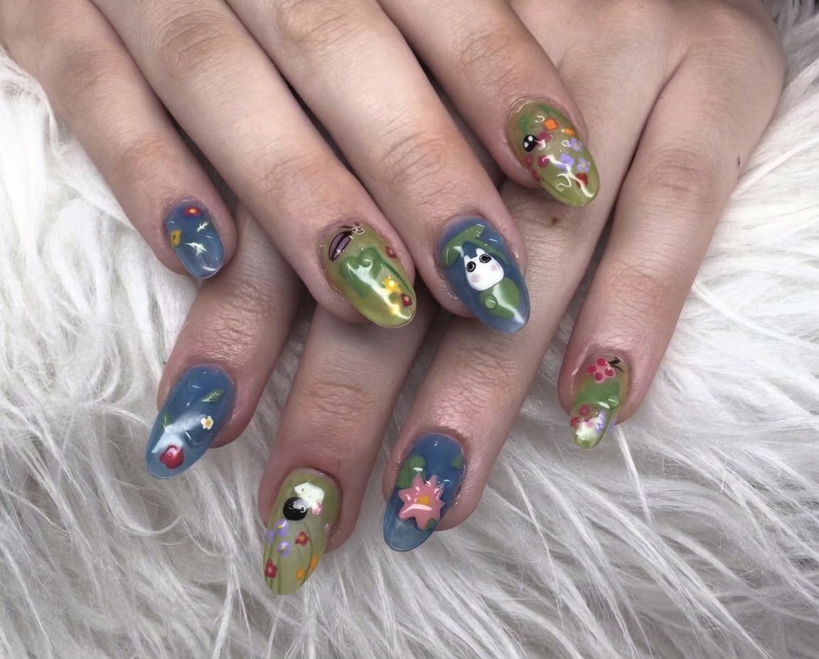 Blue and green garden-inspired character nail art