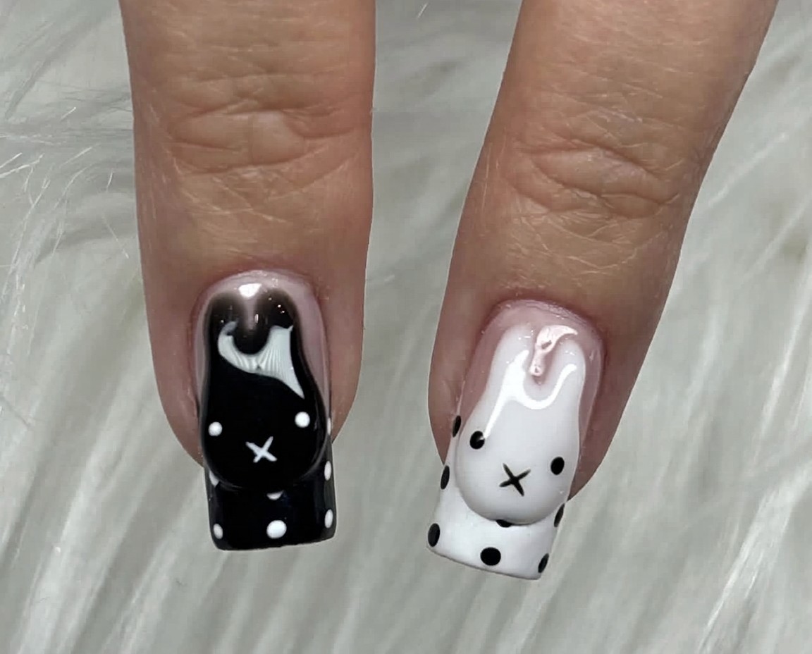 Black and white bunny nails with polka dots
