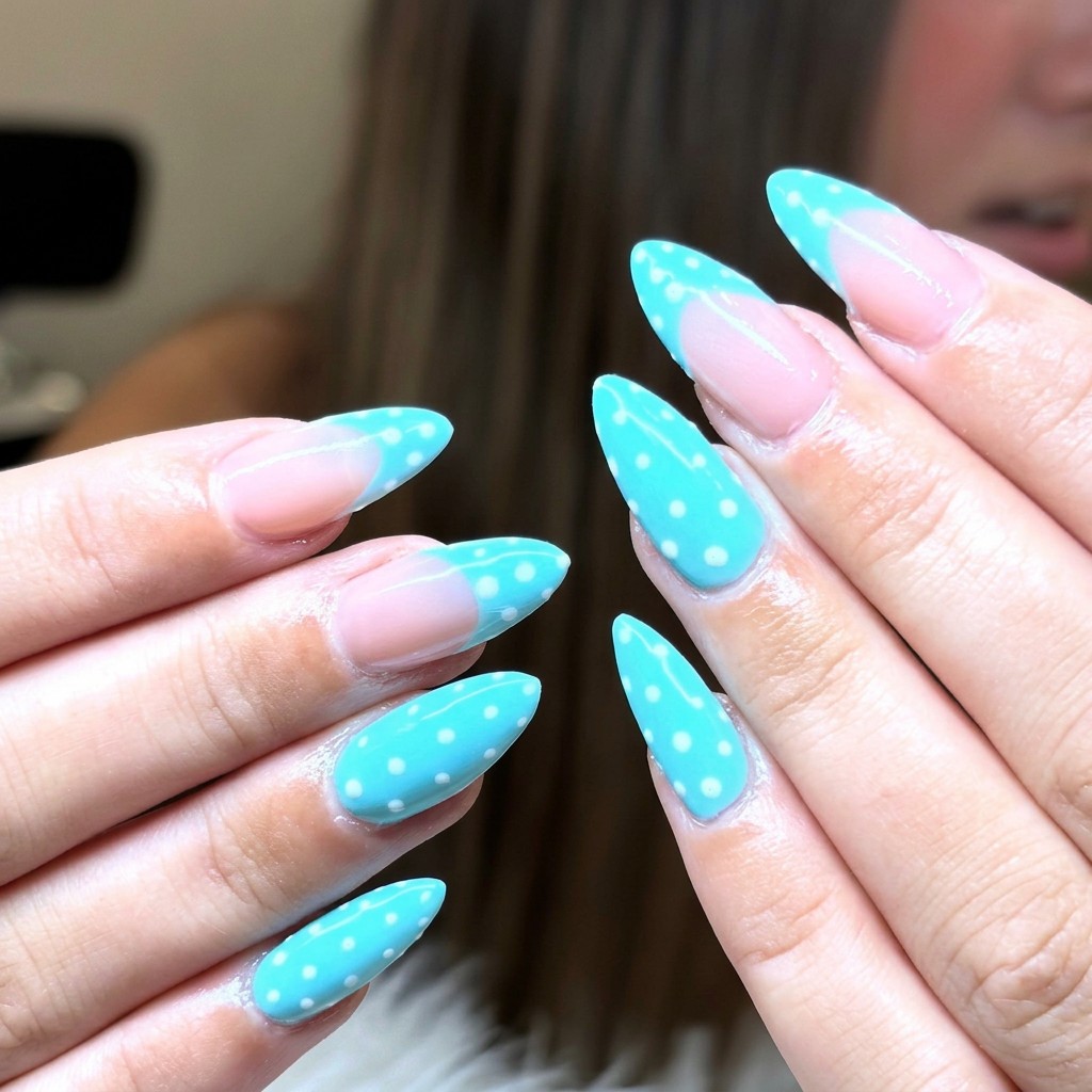 Turquoise polka-dot almond nails